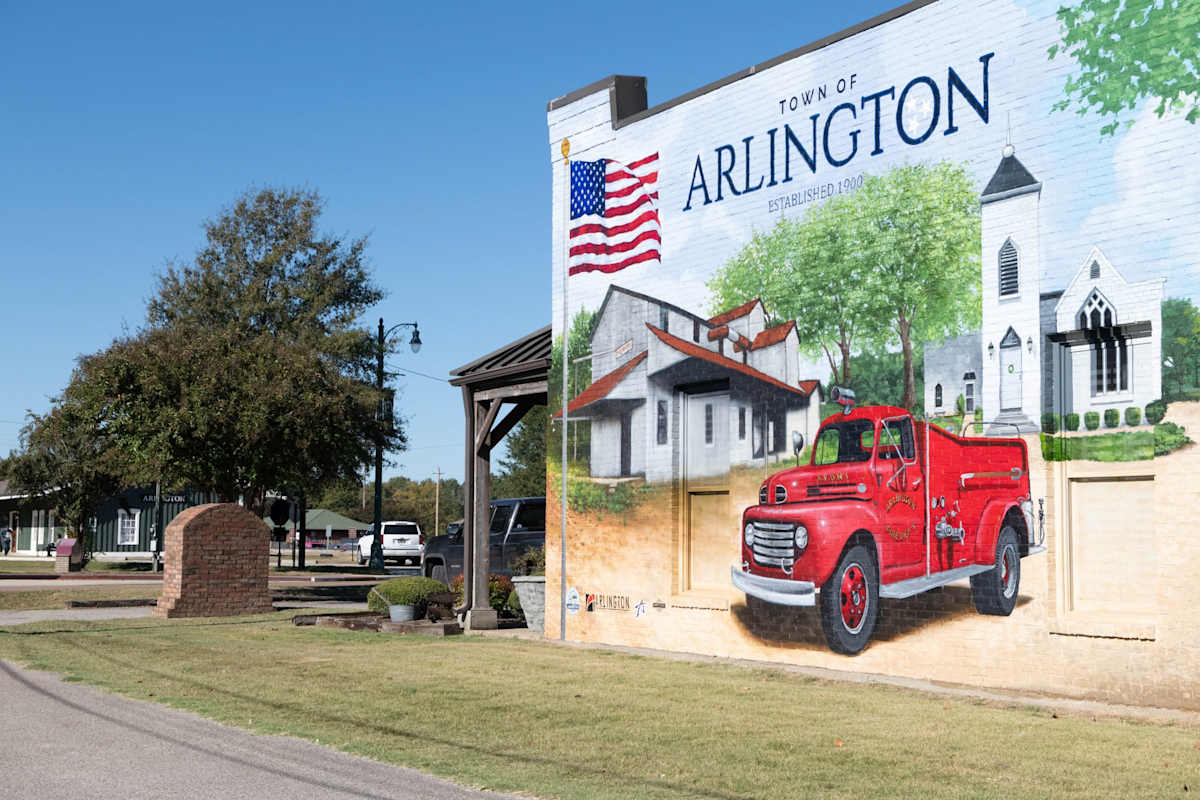 a mural of a truck on the side of a building